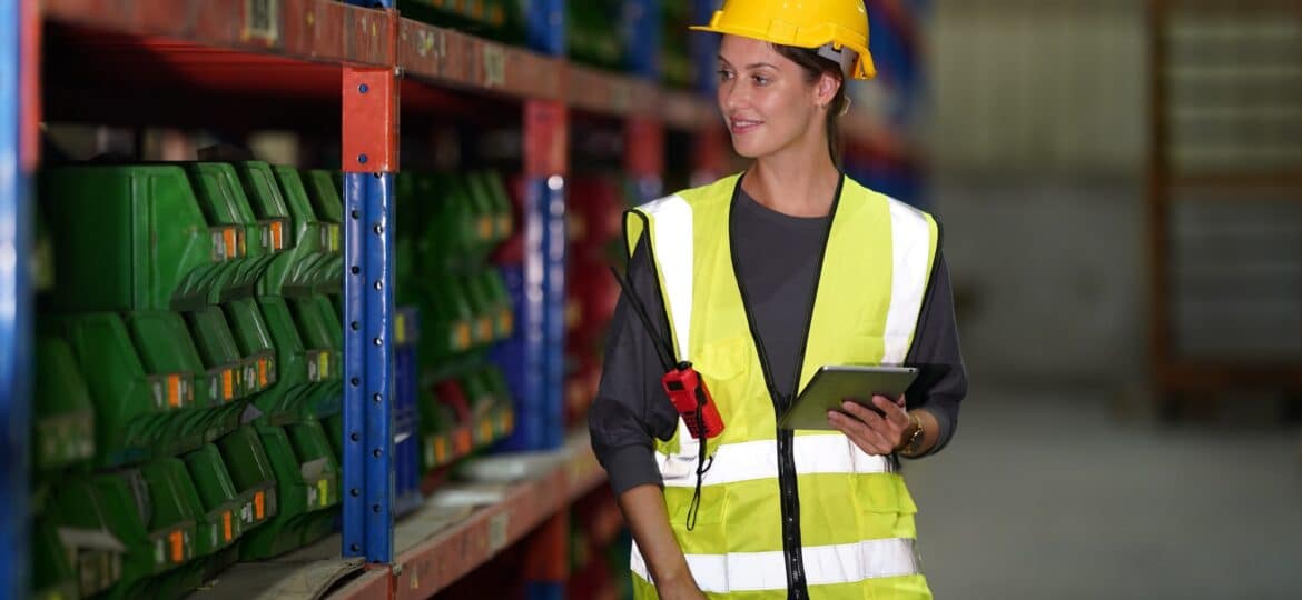 Warehouse Industrial supply chain and Logistics Companies inside. Warehouse workers checking the inv